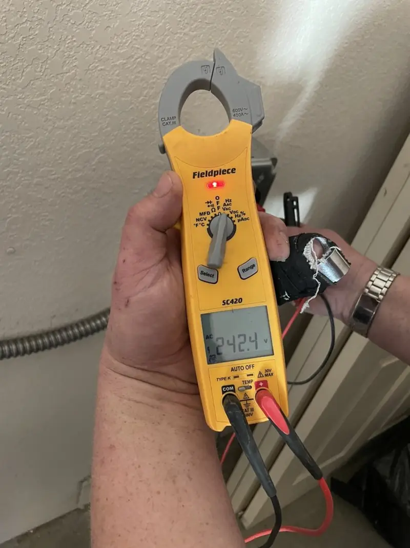 Voltage testing with clamp meter during Electrical Installation Services in Bay Hill